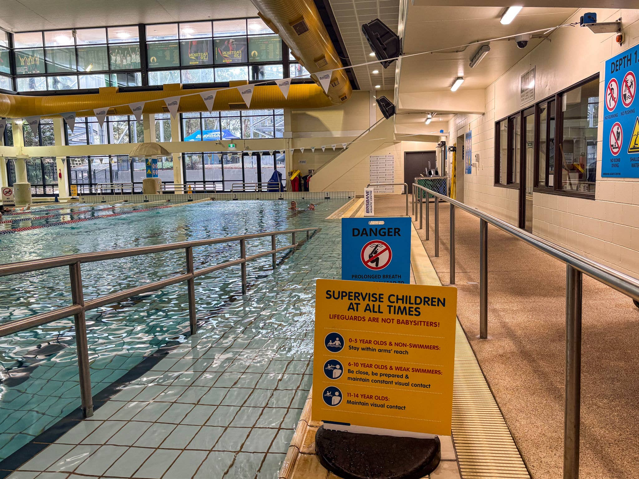 Multiple people in a pool taking an aquatic class