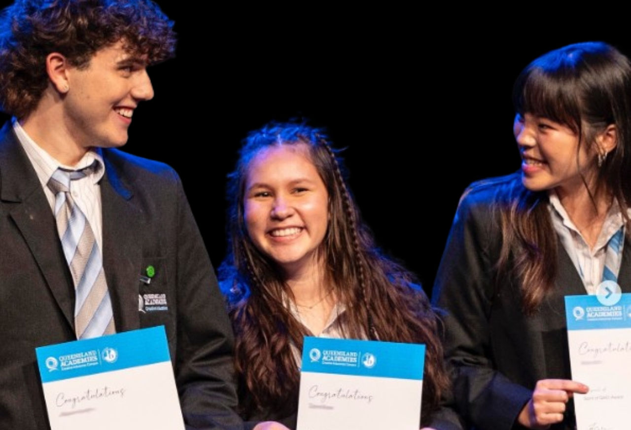 Students holding certificates 